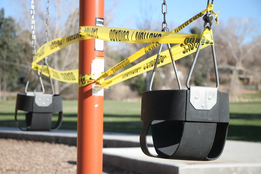 Caution tape wraps swings at Sterne Park. Amid statewide stay-at-home orders, even playgrounds are off-limits.